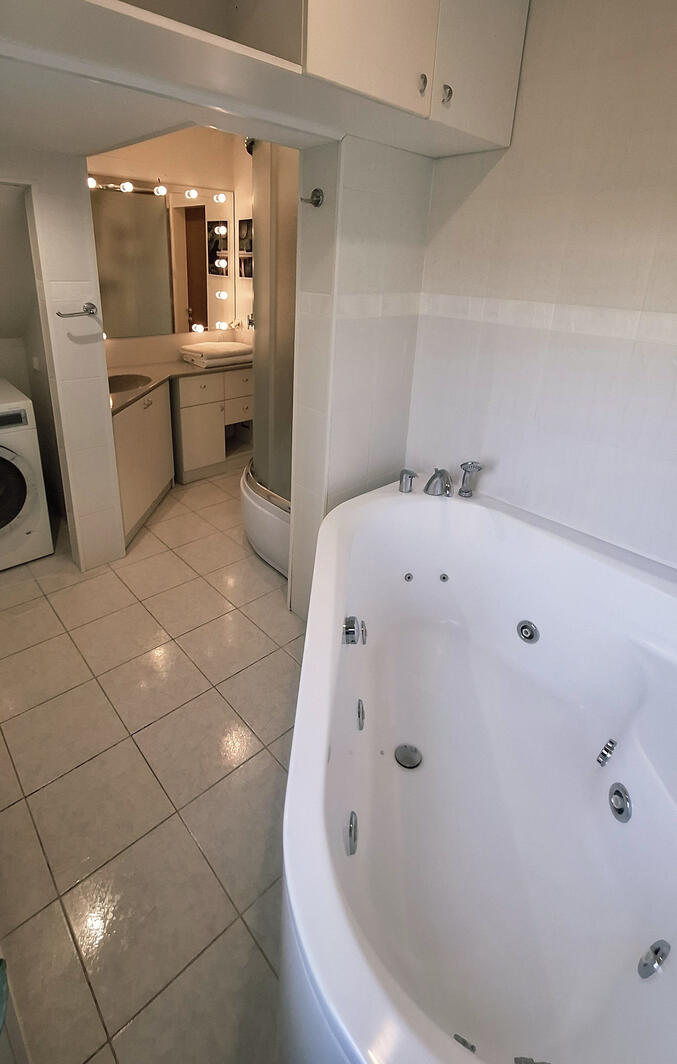 Bathroom There is all You need - jacuzzi, shower, big mirror with lights and washing machine